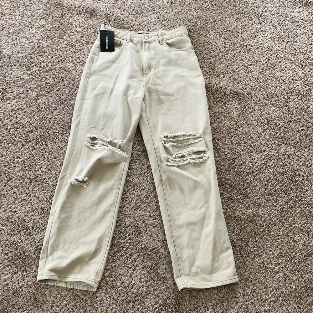 Tan high-waisted, wide-leg, baggy, ripped jeans